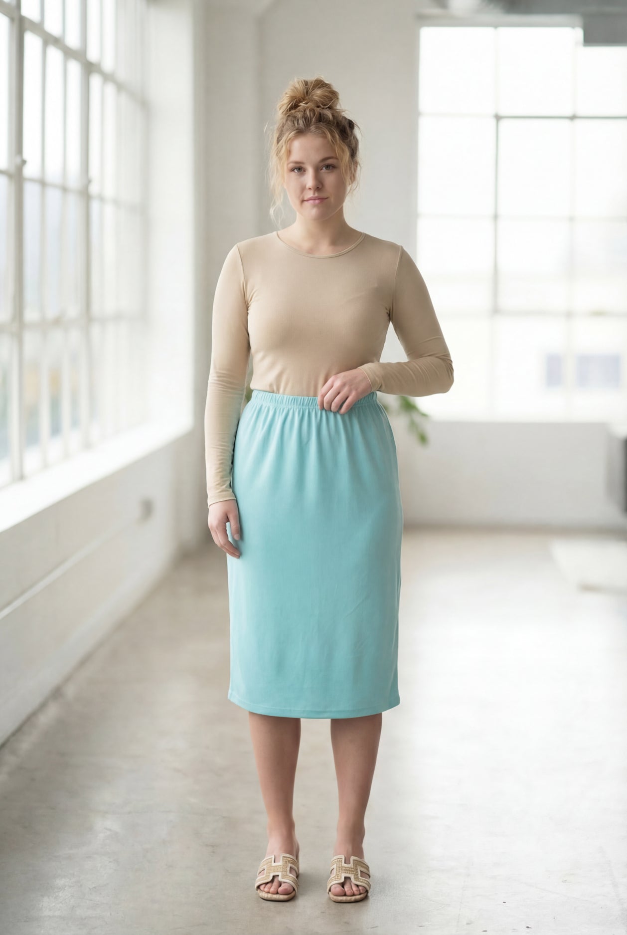 Model wearing Nuggles® 27" Classic Skirt in Aqua
