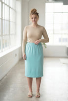 Model wearing Nuggles® 27" Classic Skirt in Aqua
