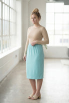 Model wearing Nuggles® 27" Classic Skirt in Aqua