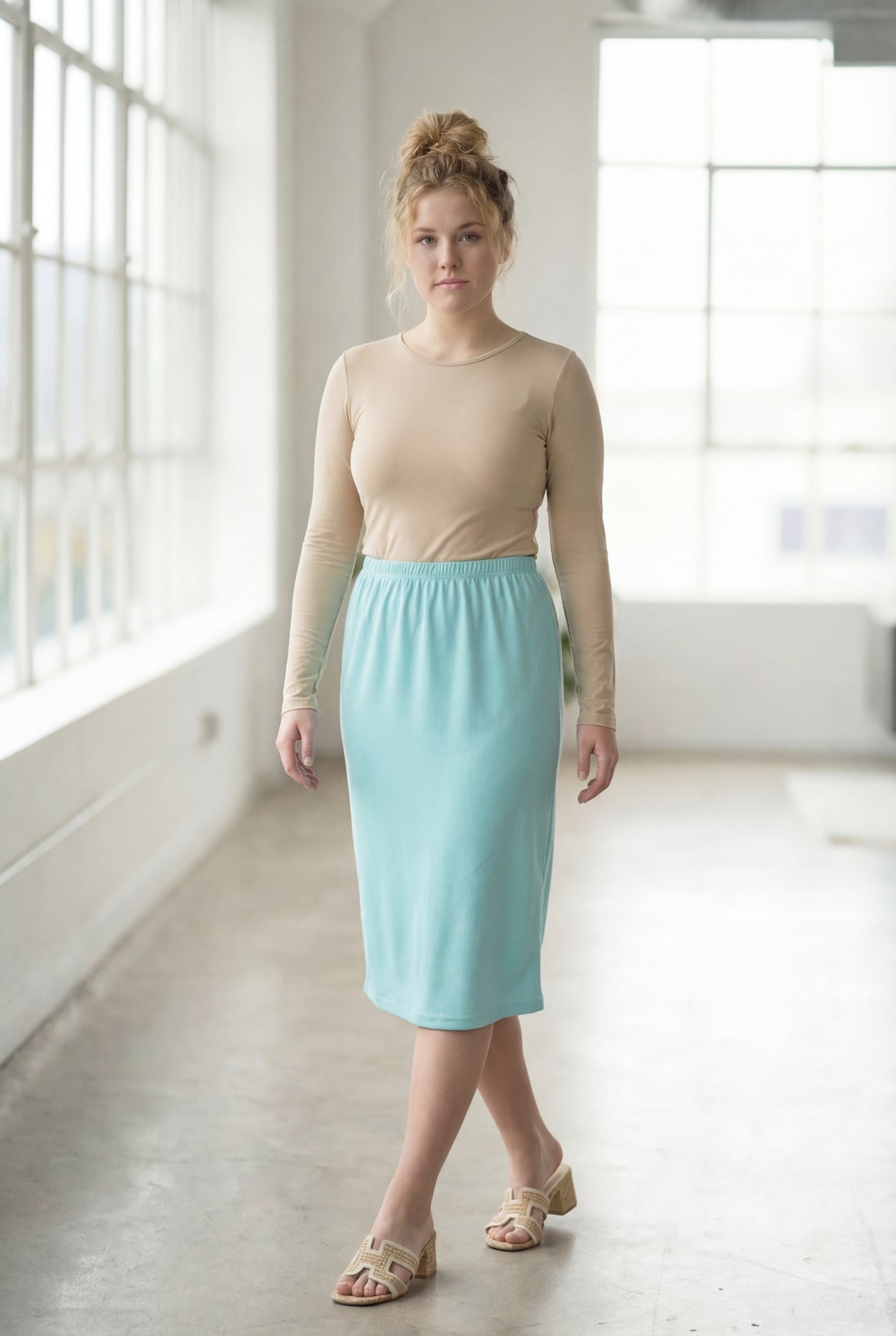 Model wearing Nuggles® 27" Classic Skirt in Aqua