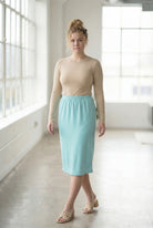 Model wearing Nuggles® 27" Classic Skirt in Aqua