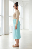 Model wearing Nuggles® 31" Classic Skirt in Aqua