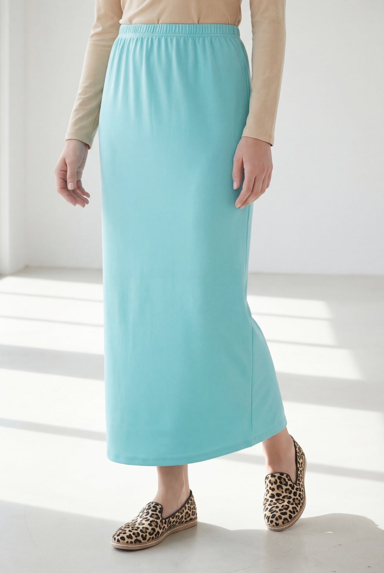 Model wearing Nuggles® 36" Classic Skirt in Aqua