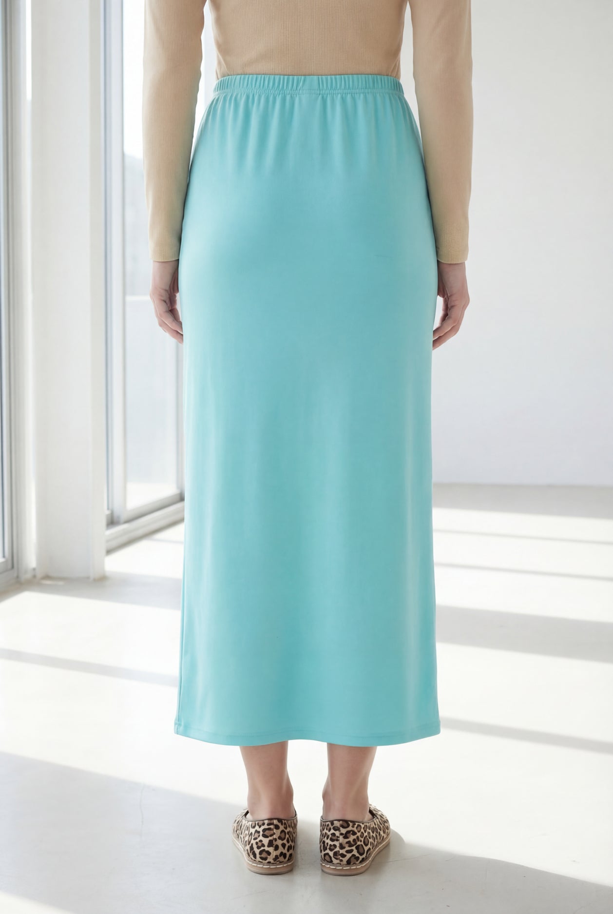 Model wearing Nuggles® 36" Classic Skirt in Aqua