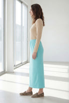 Model wearing Nuggles® 36" Classic Skirt in Aqua