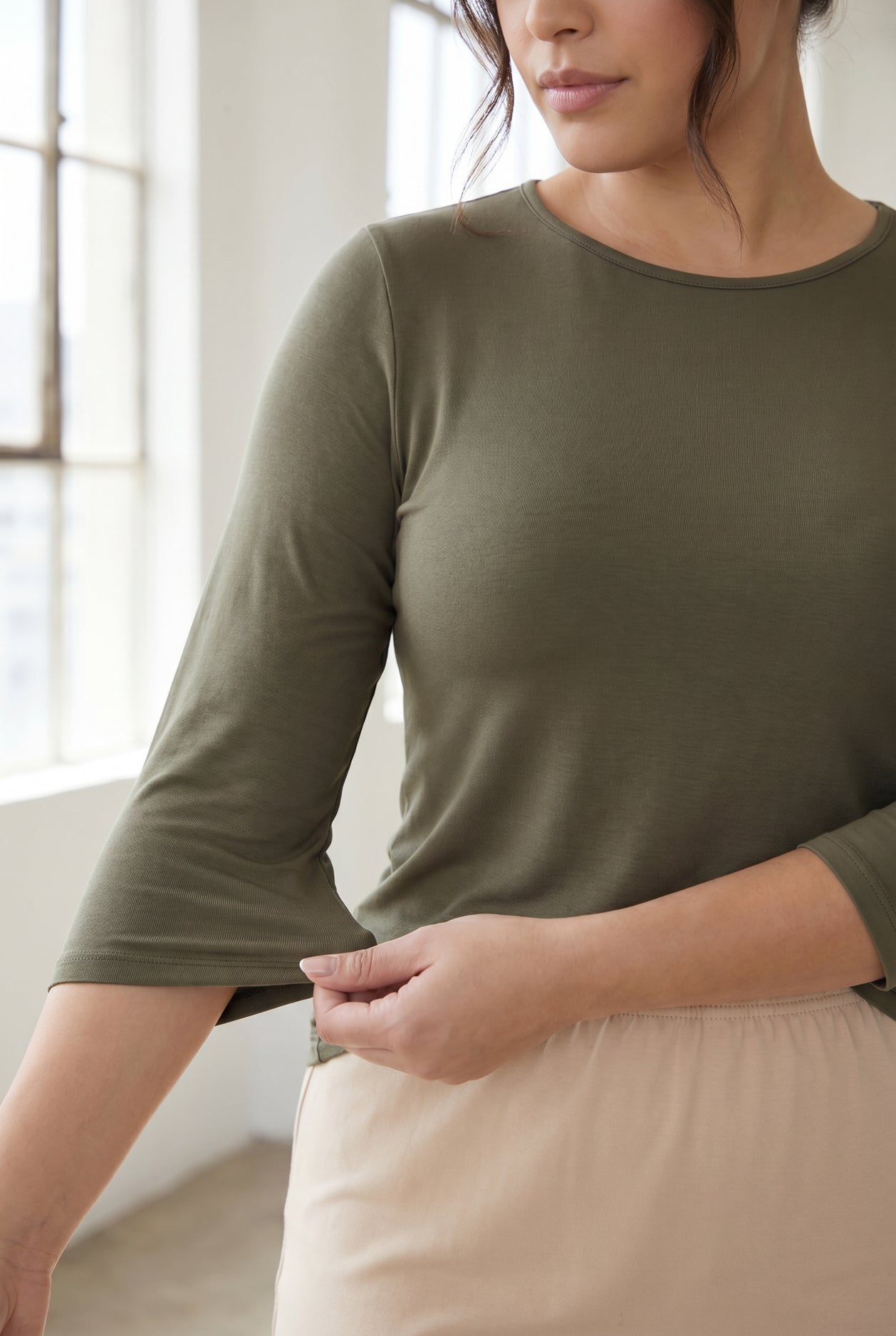 Model wearing Nuggles®  Half Sleeve Essential Tee in Army Green