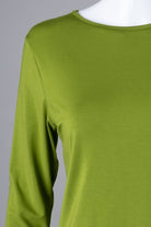 Model wearing Nuggles® 3/4 Essential Tee in Avacado