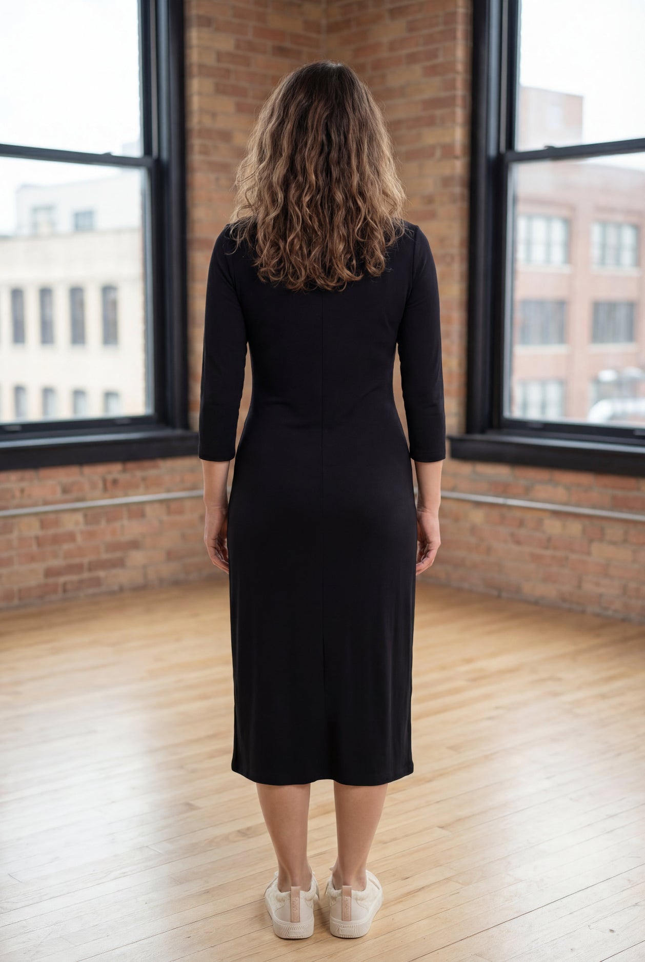Model wearing Nuggles® Midi Layering Dress in Black