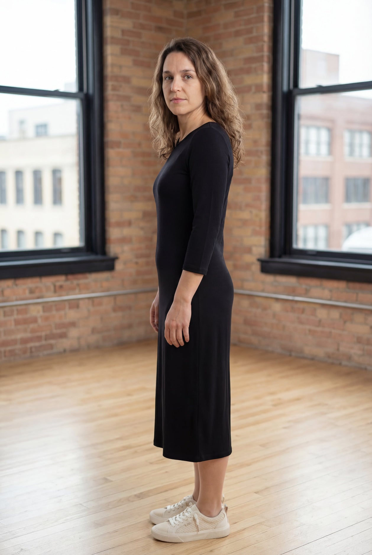 Model wearing Nuggles® Midi Layering Dress in Black