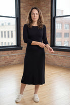 Model wearing Nuggles® Midi Layering Dress in Black