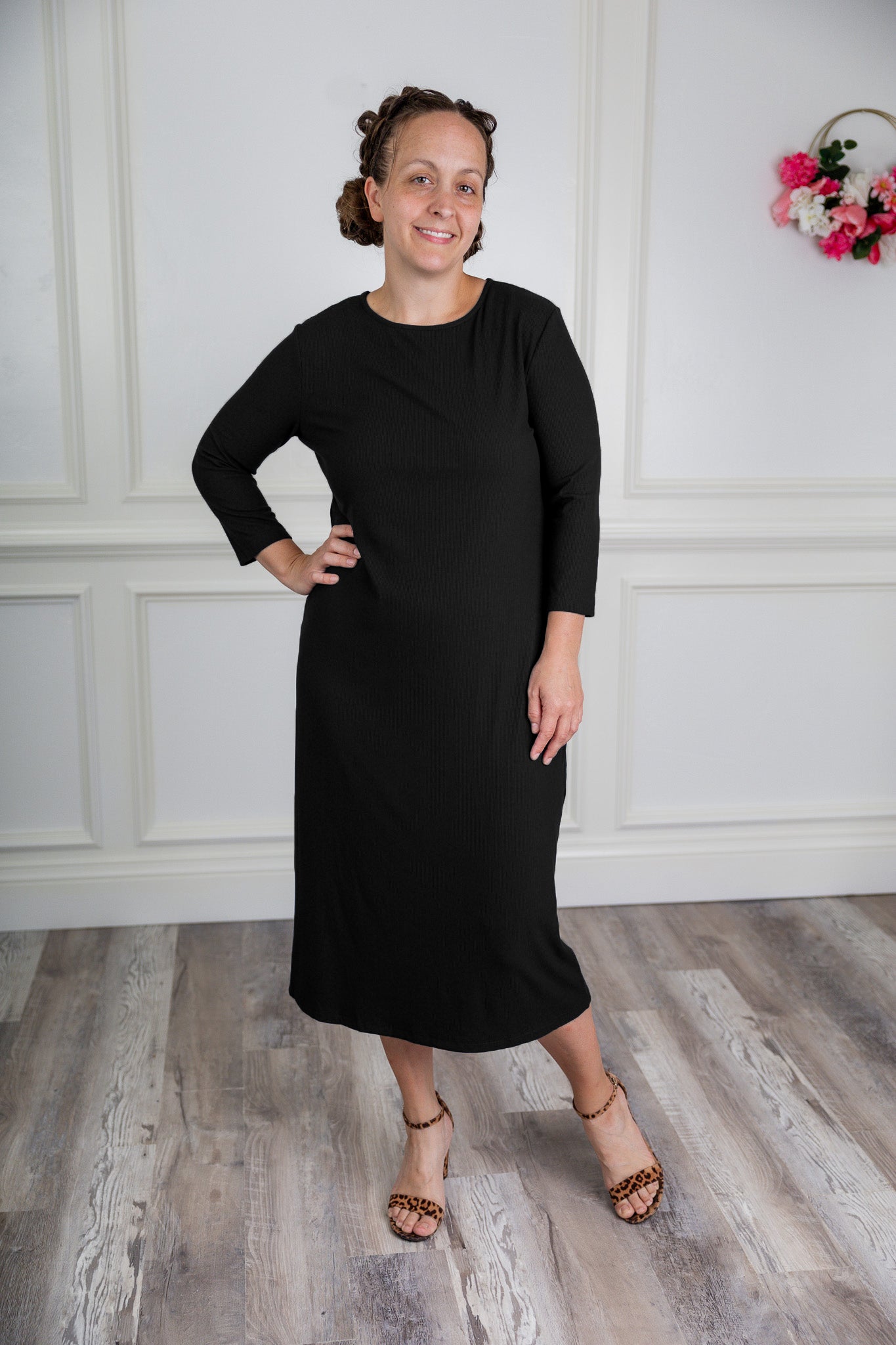 model wearing a ribbed midi dress from Nuggles® with modest 3/4 sleeves and high neckline.