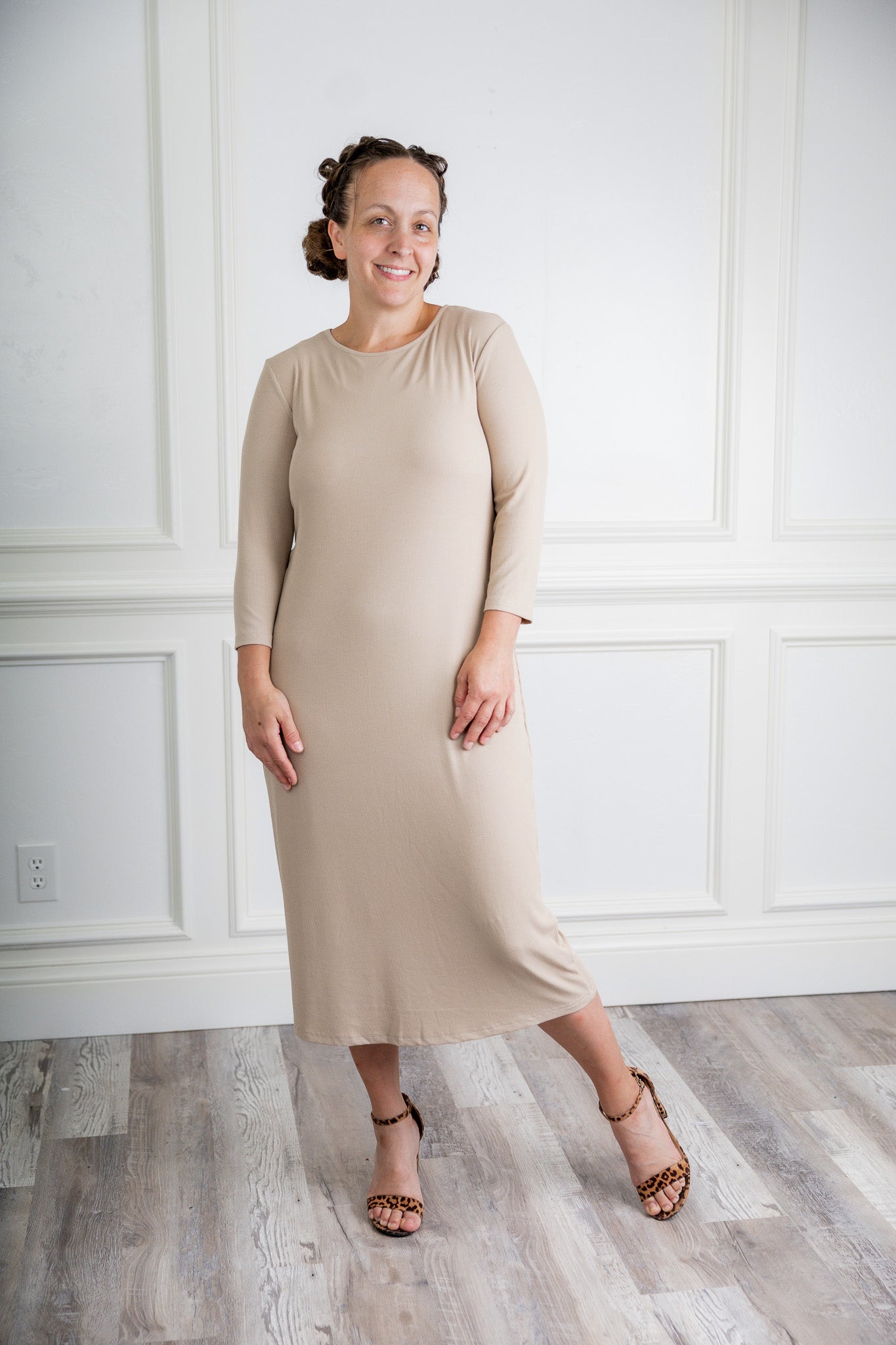 model wearing a ribbed midi dress from Nuggles® with modest 3/4 sleeves and high neckline.