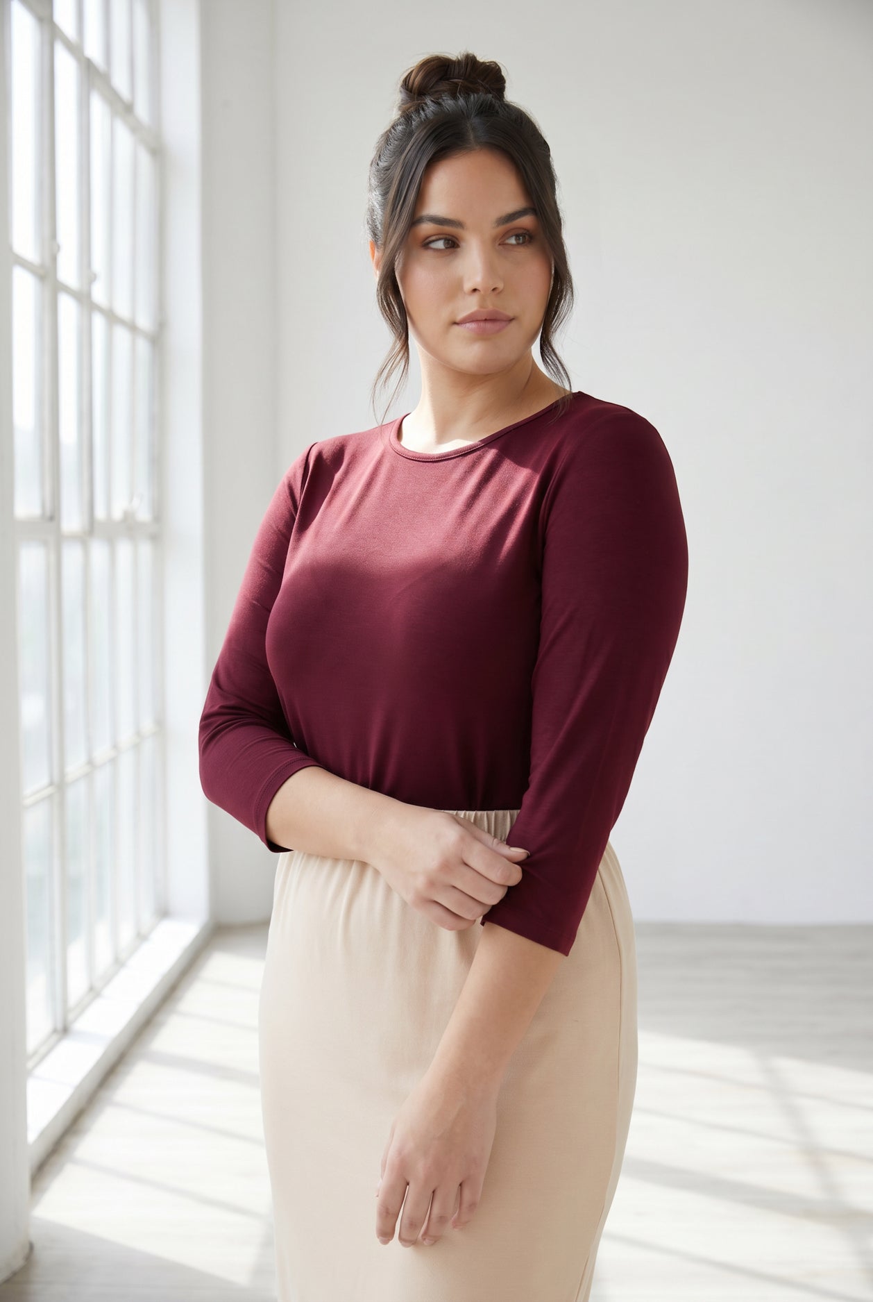 Model wearing Nuggles®  Half Sleeve Essential Tee in Burgundy