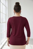 Model wearing Nuggles®  Half Sleeve Essential Tee in Burgundy
