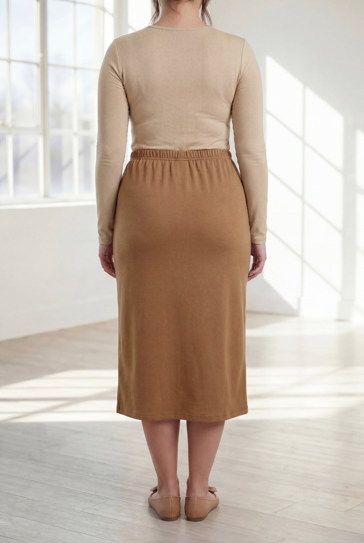 Model wearing Nuggles®  31" Classic Skirt in Camel
