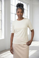 Model wearing Nuggles®  Half Sleeve Essential Tee in Cream