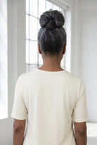 Model wearing Nuggles®  Half Sleeve Essential Tee in Cream