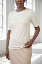 Model wearing Nuggles®  Half Sleeve Essential Tee in Cream