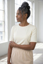 Model wearing Nuggles®  Half Sleeve Essential Tee in Cream
