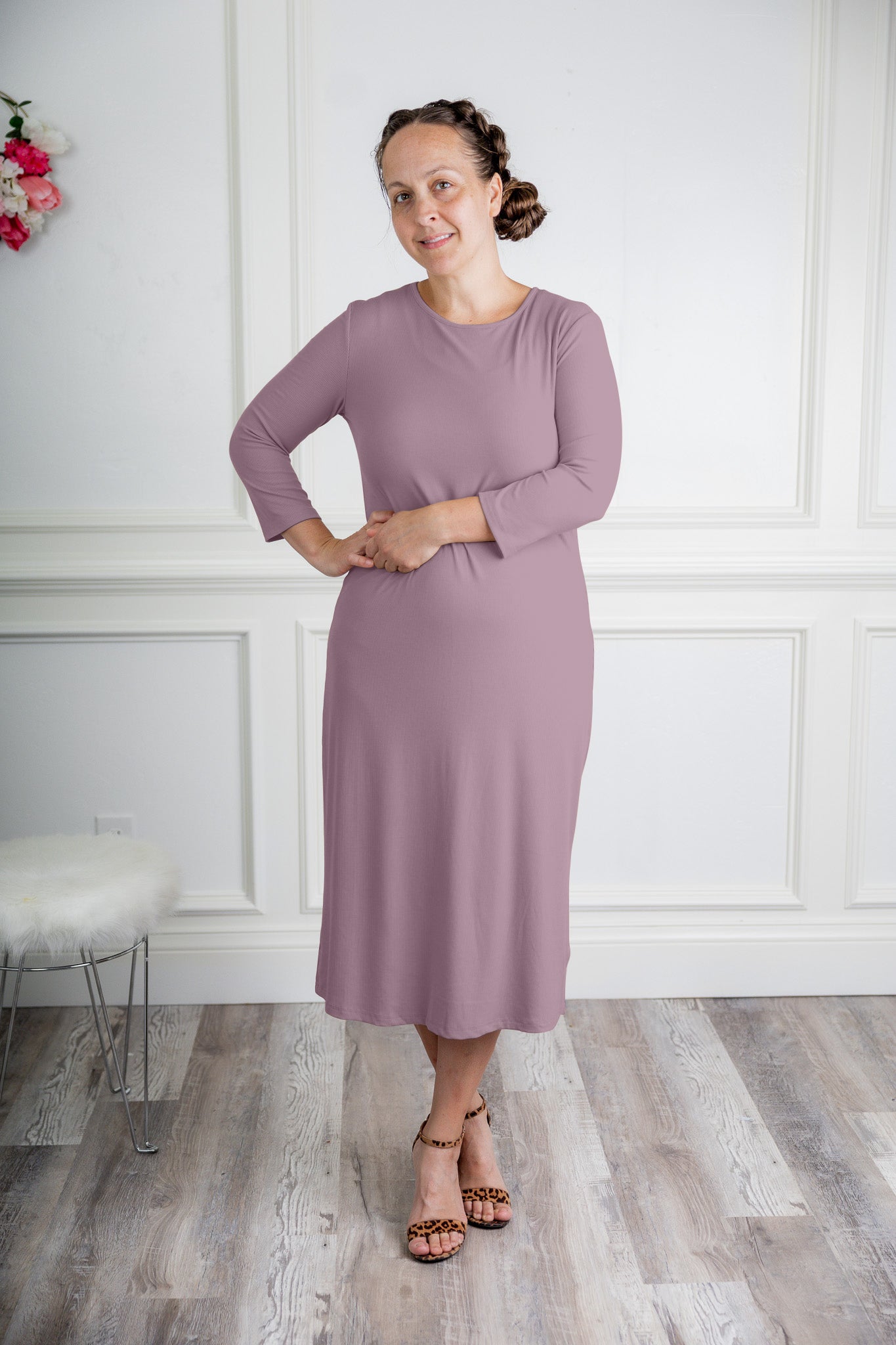 model wearing a ribbed midi dress from Nuggles® with modest 3/4 sleeves and high neckline.