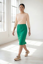 Model wearing Nuggles® 25" Classic Skirt in Kelly Green