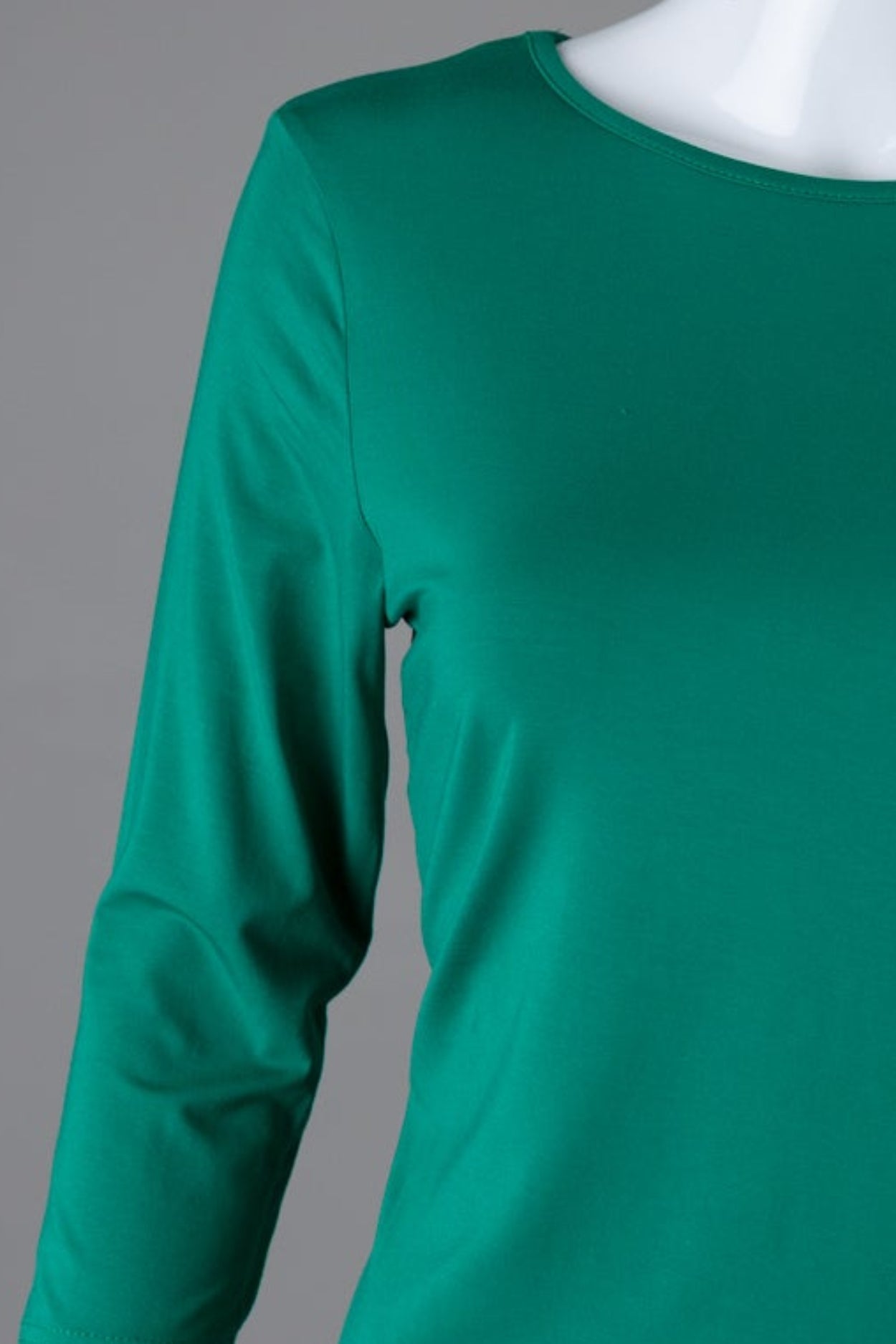 Model wearing Nuggles® 3/4 Essential Tee in Kelly Green
