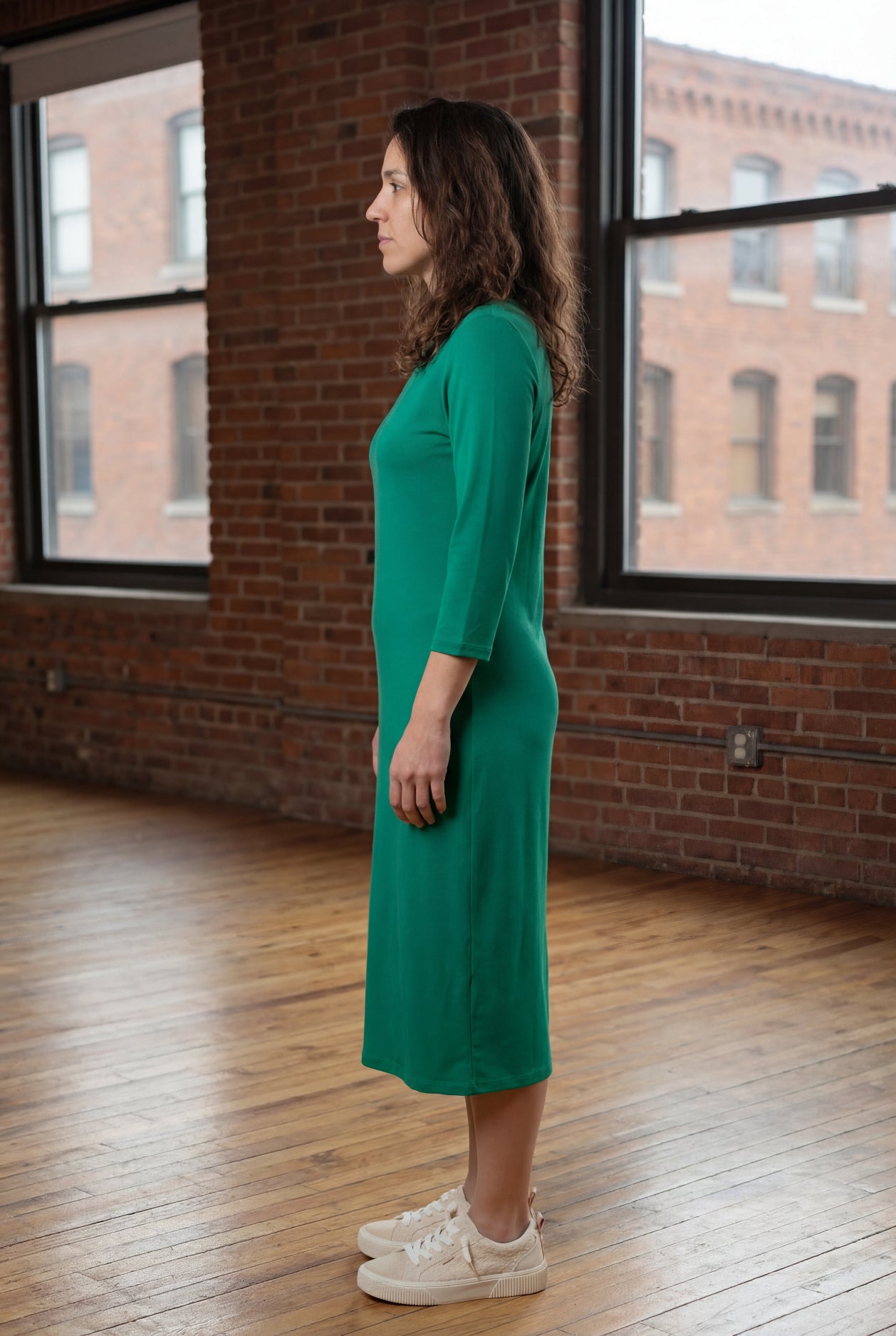 Model wearing Nuggles® Midi Layering Dress in Kelly Green