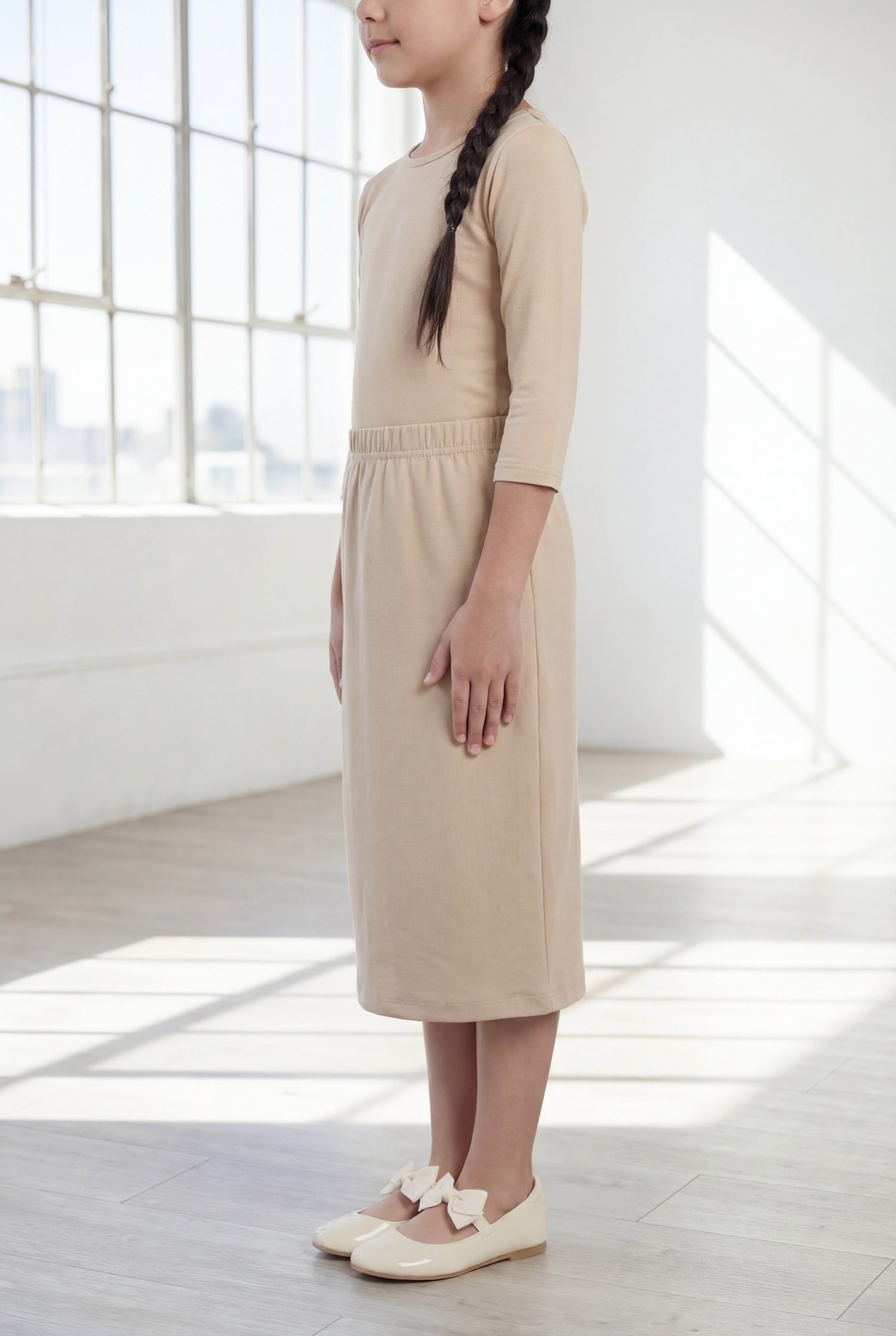 Our Nuggles® Girls' midi classic skirt in with elastic waistband and straight silhouette