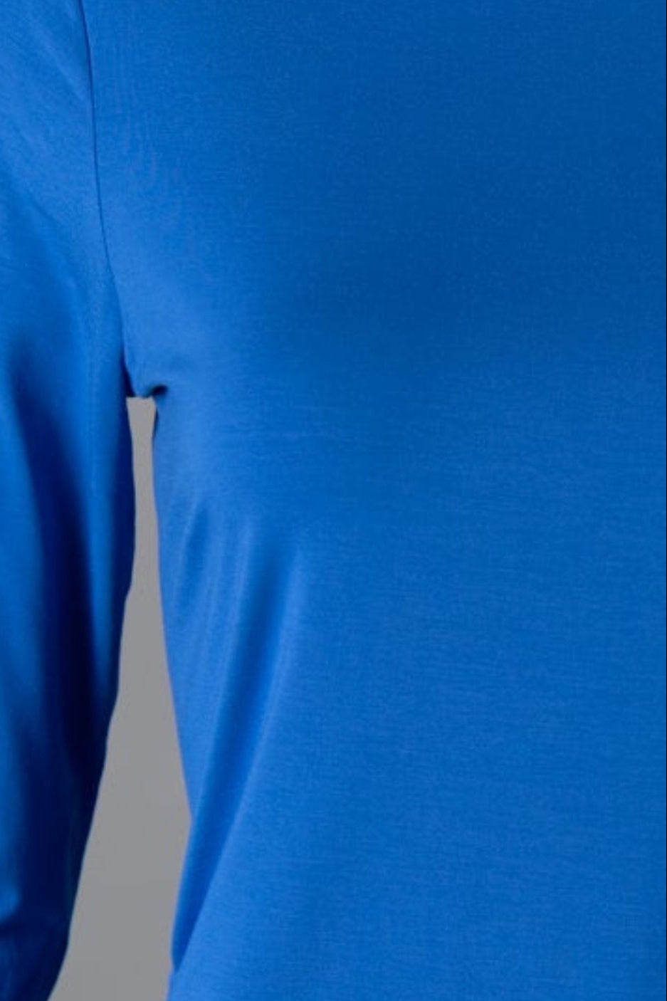 Model wearing Nuggles® 3/4 Essential Tee in Lapiz Blue