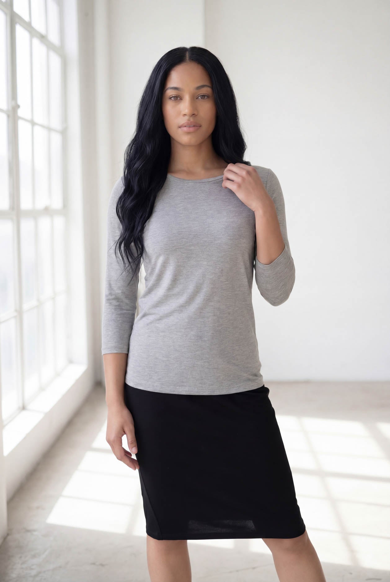 Model wearing Nuggles® 3/4 Essential Tee in Light Heather Gray