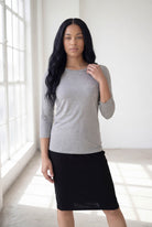 Model wearing Nuggles® 3/4 Essential Tee in Light Heather Gray