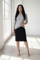Model wearing Nuggles® 3/4 Essential Tee in Light Heather Gray