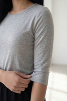 Model wearing Nuggles® 3/4 Essential Tee in Light Heather Gray