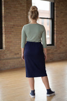 Model wearing Nuggles® 27" Classic Skirt  in Navy