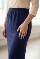 Model wearing Nuggles® 25" Classic Skirt in Navy
