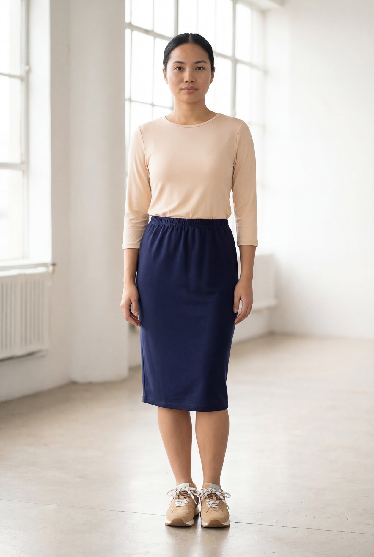 Model wearing Nuggles® 25" Classic Skirt in Navy