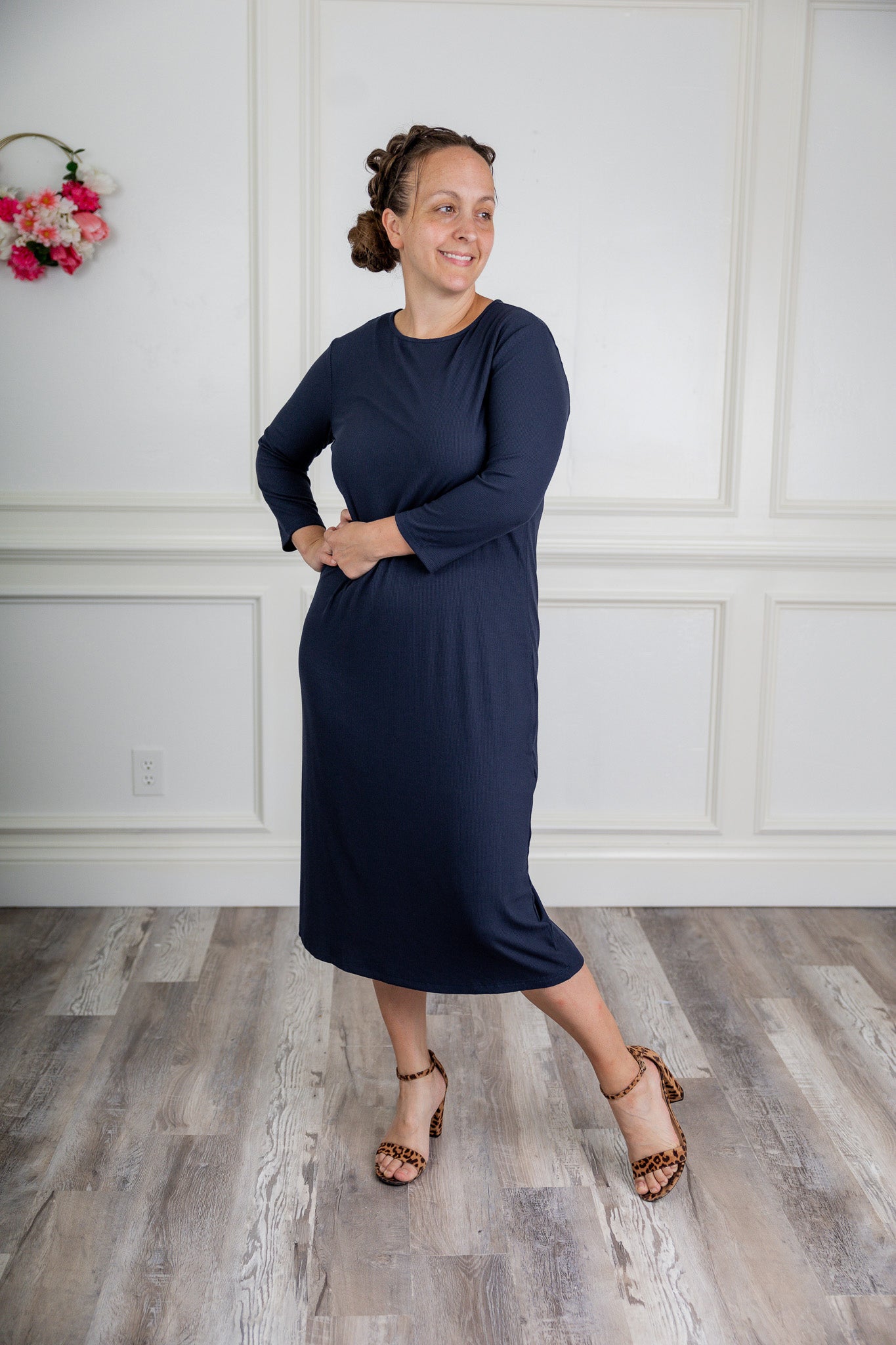 model wearing a ribbed midi dress from Nuggles® with modest 3/4 sleeves and high neckline.