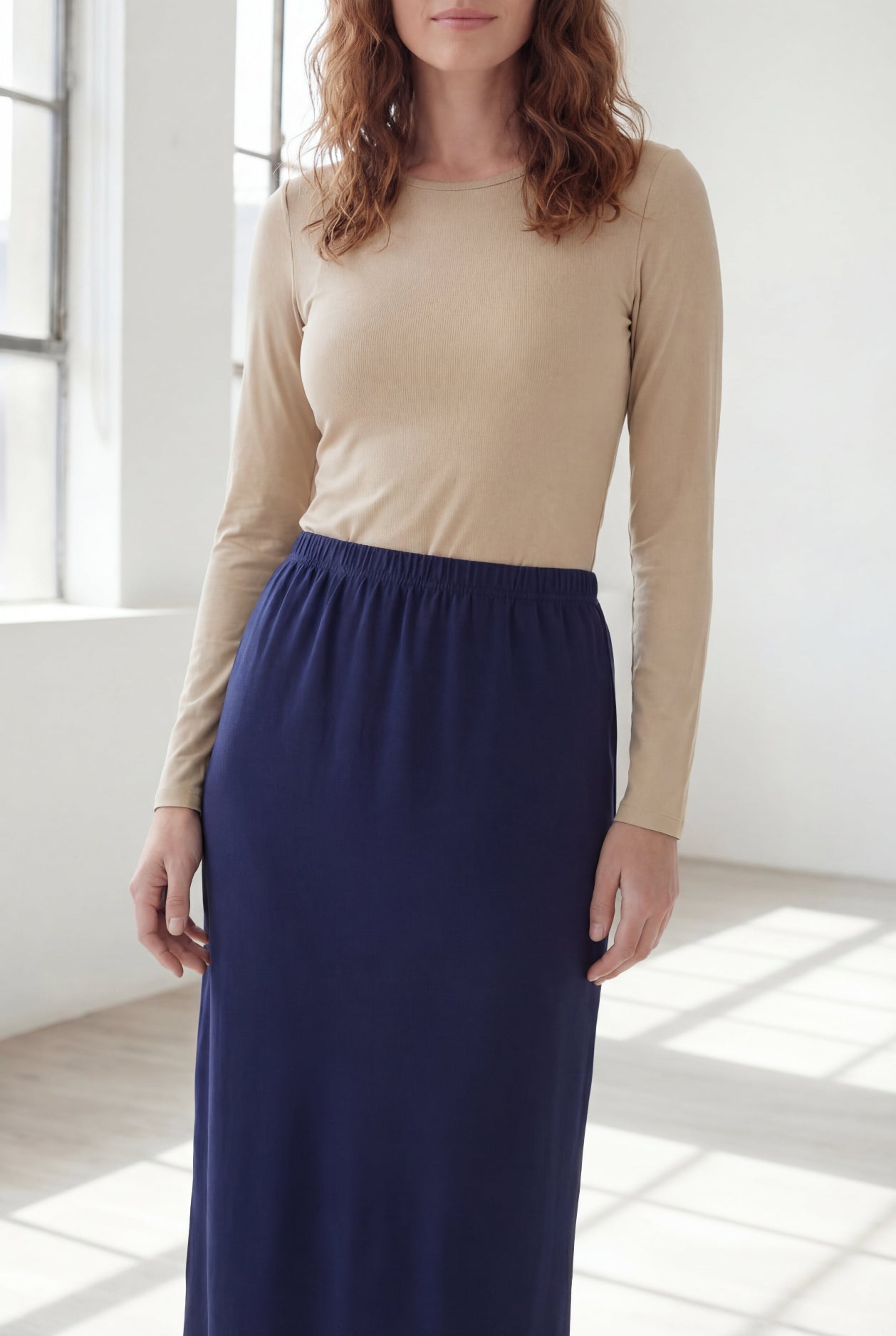 Model wearing Nuggles® 36" Classic Skirt in Navy
