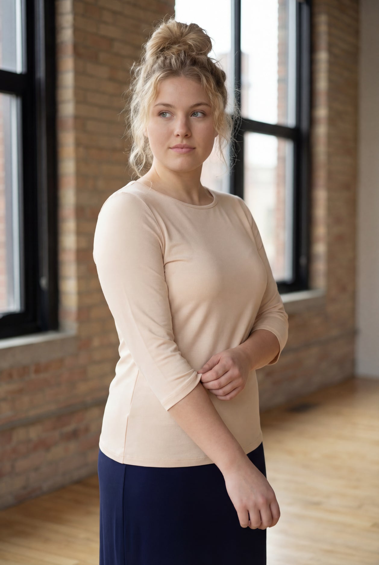 Model wearing Nuggles® 3/4 Essential Tee in Nude