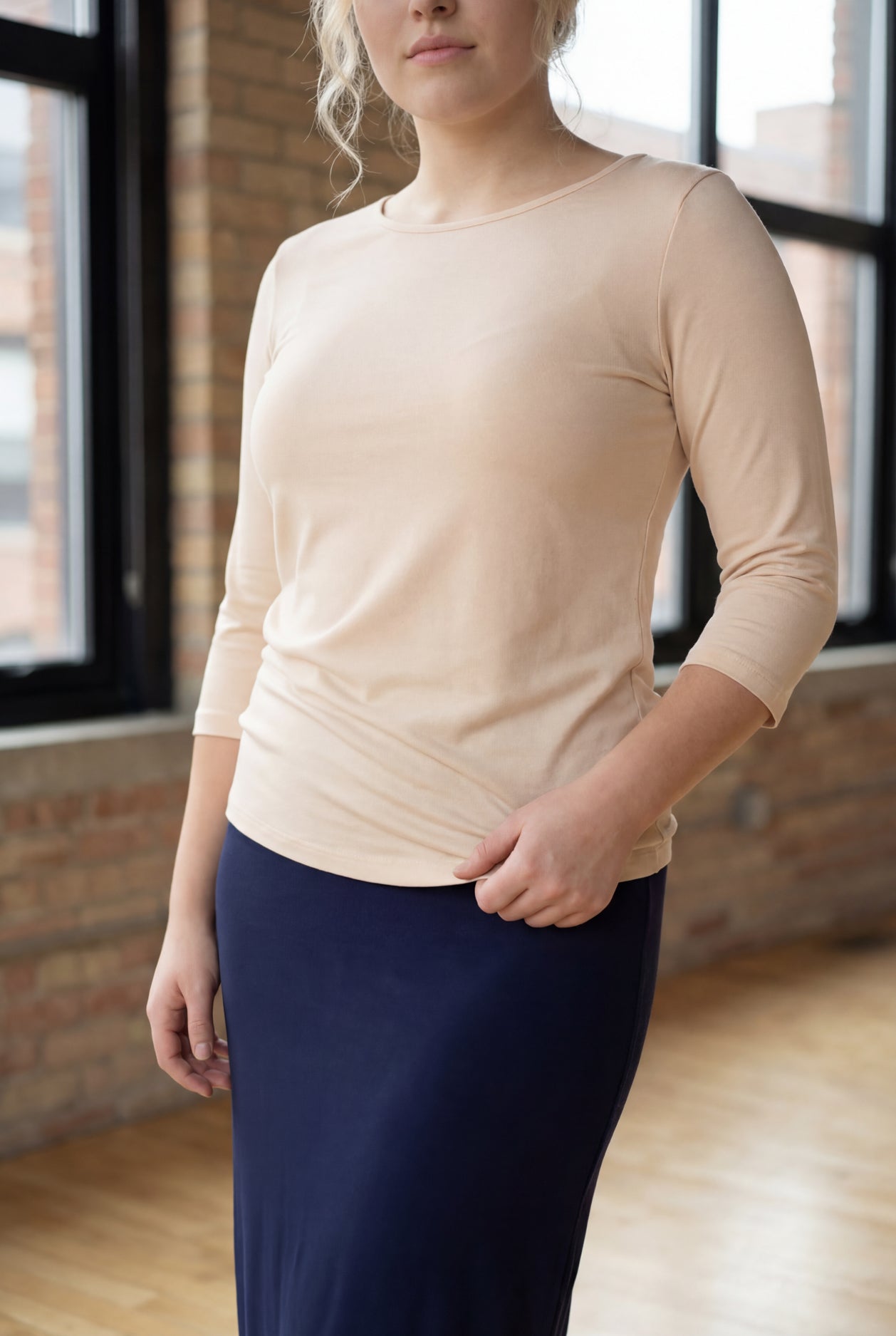 Model wearing Nuggles® 3/4 Essential Tee in Nude