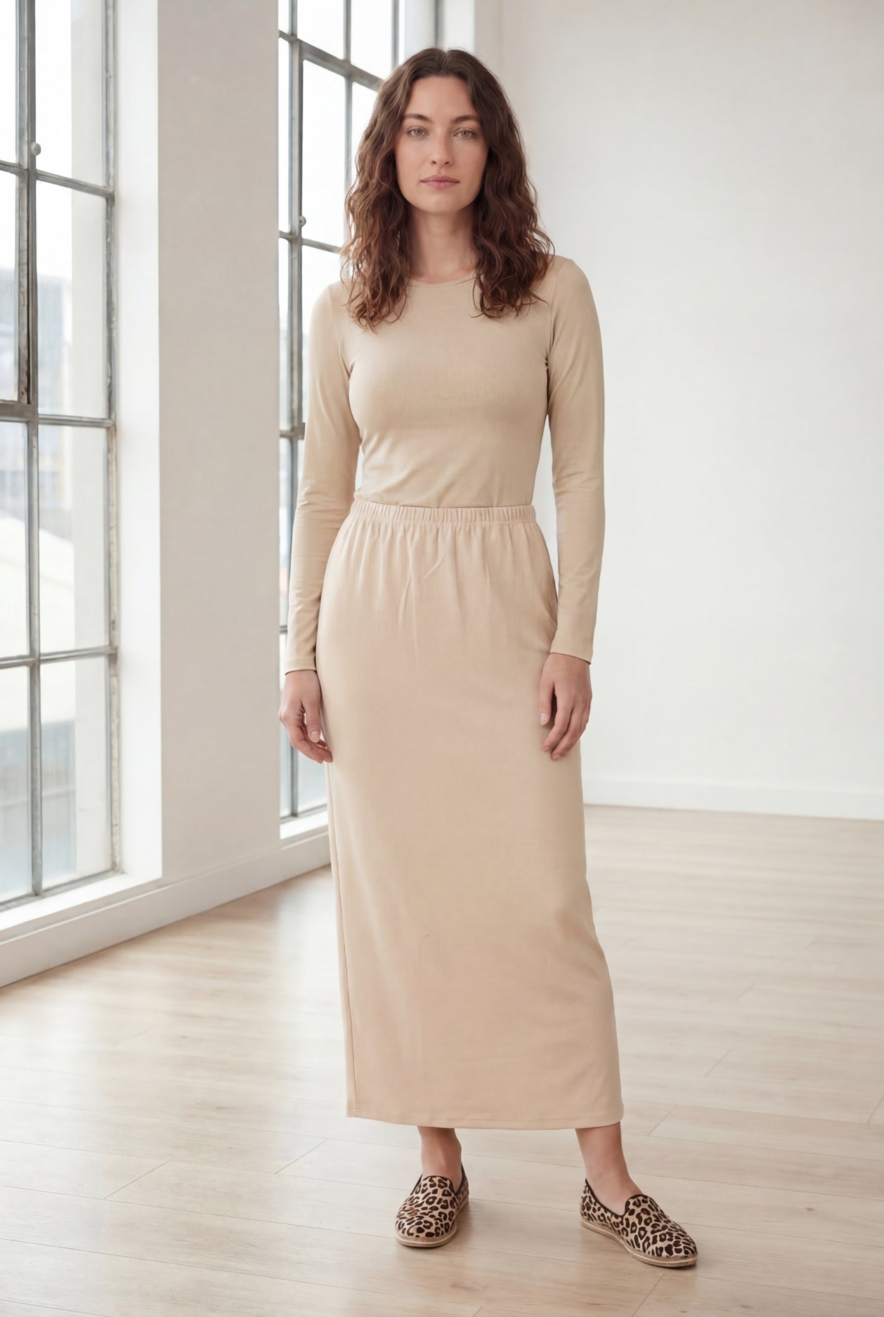 Model wearing Nuggles® 36" Classic Skirt in Nude
