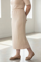 Model wearing Nuggles® 34" Classic Skirt in Nude
