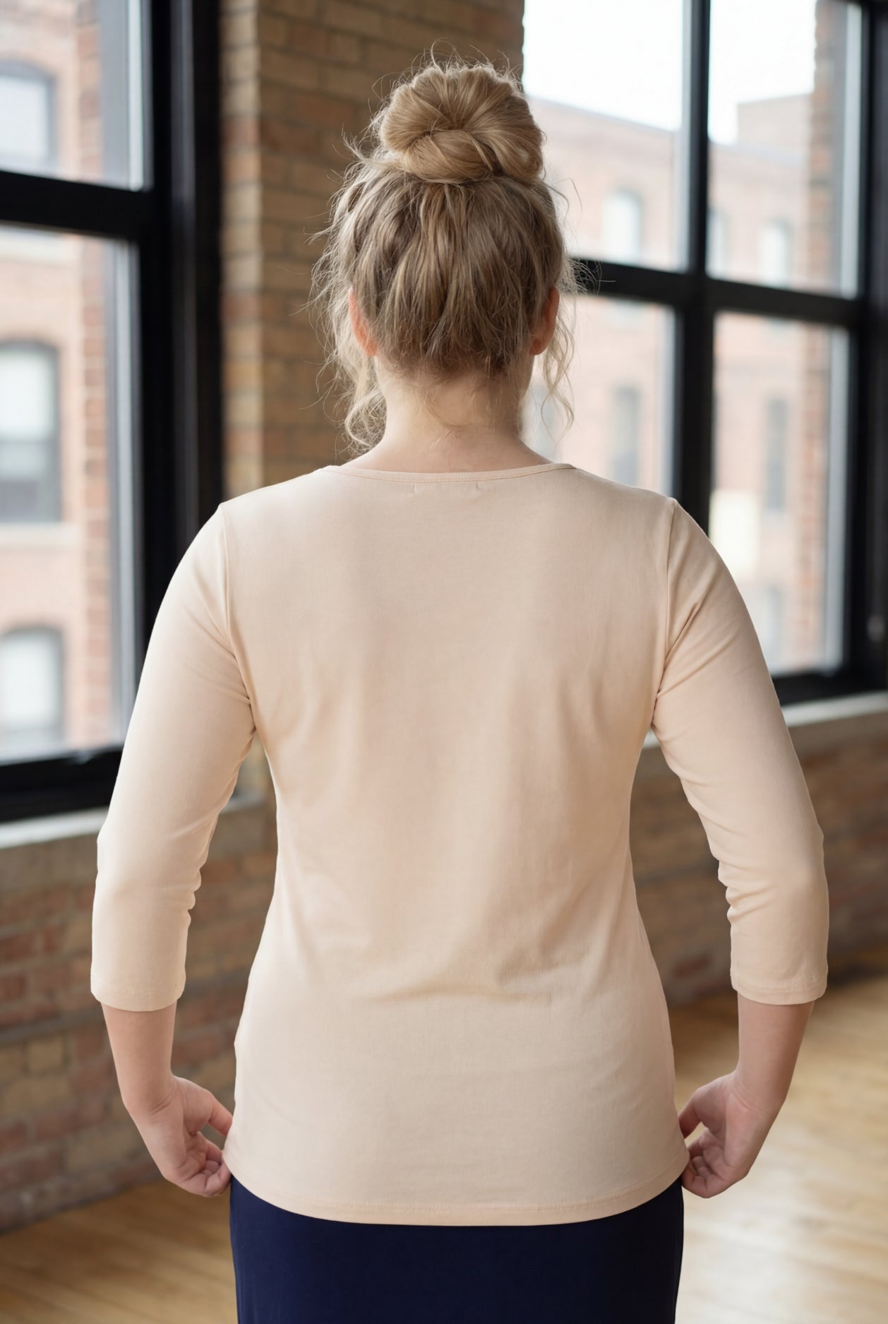 Model wearing Nuggles® 3/4 Essential Tee in Nude