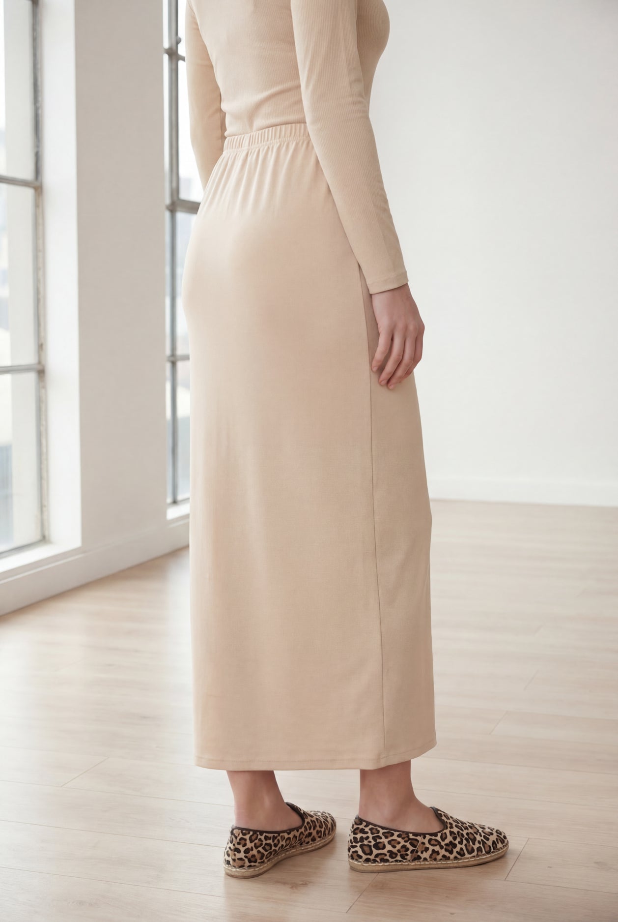 Model wearing Nuggles® 36" Classic Skirt in Nude