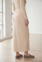 Model wearing Nuggles® 36" Classic Skirt in Nude