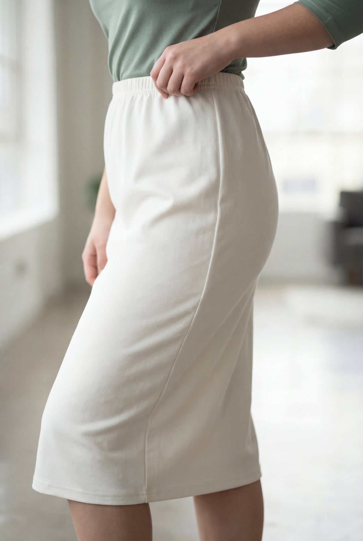 Model wearing Nuggles® 27" Classic Skirt  in Off White