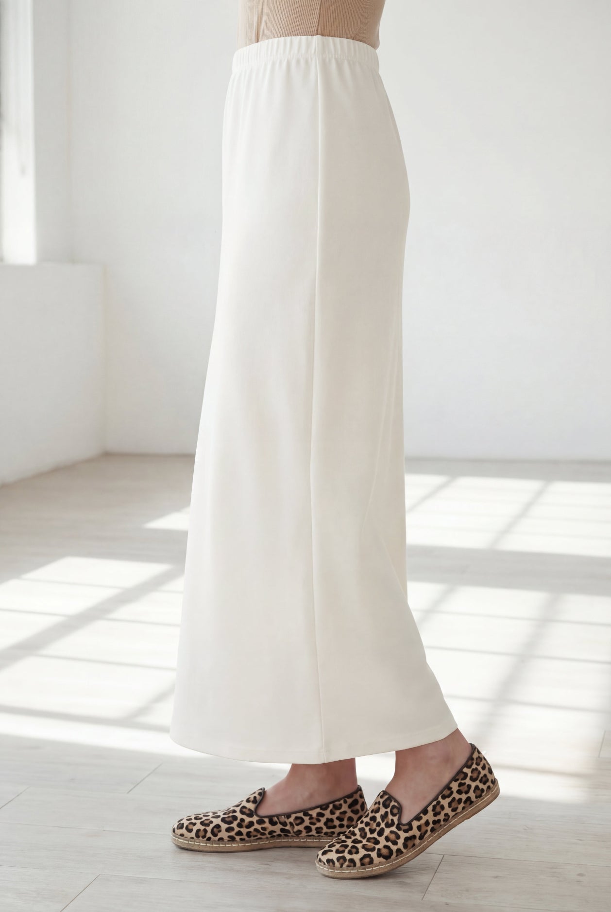 Model wearing Nuggles® 36" Classic Skirt in Off White