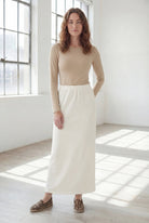 Model wearing Nuggles® 36" Classic Skirt in Off White