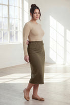 Model wearing Nuggles®  31" Classic Skirt in Olive Brown
