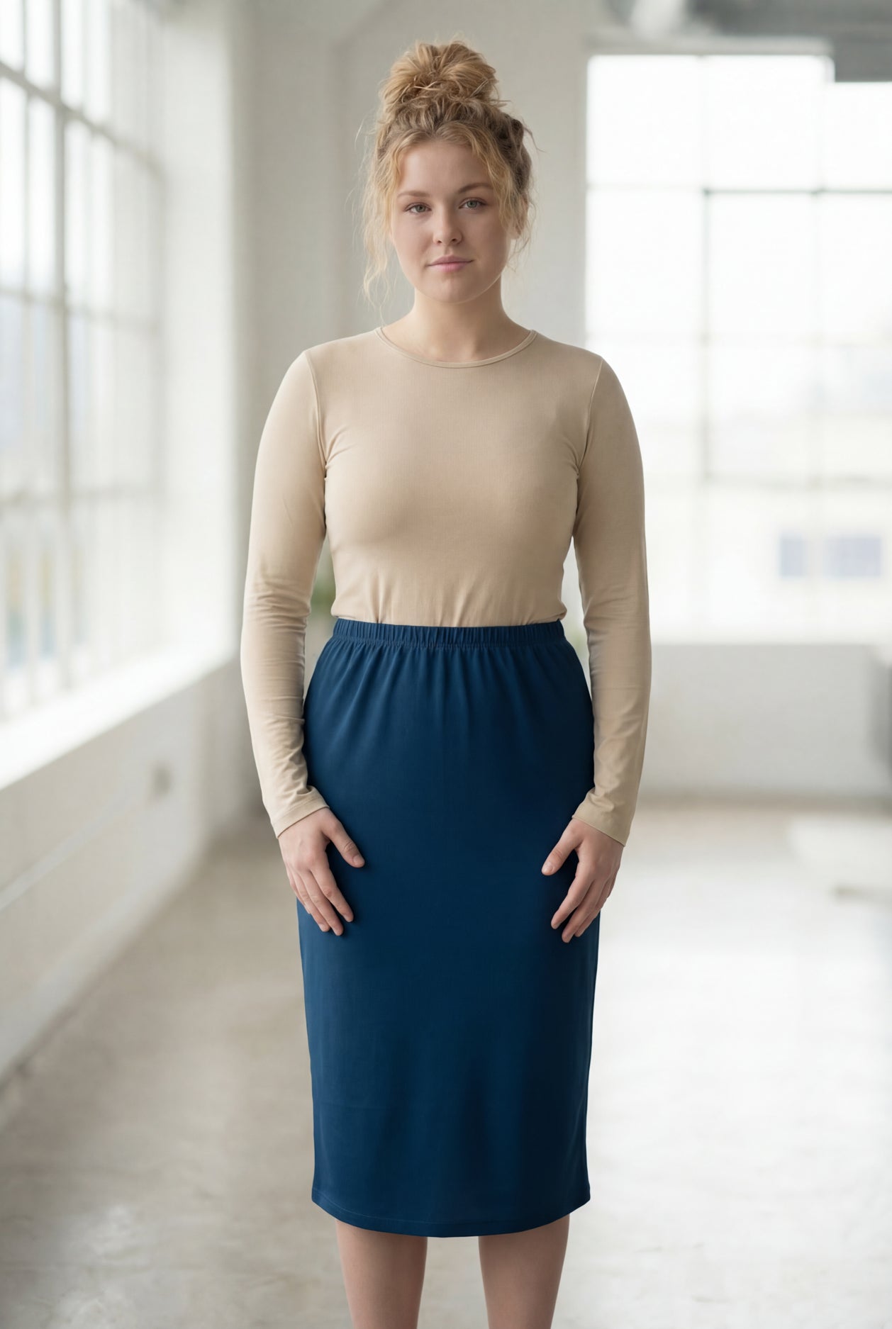 Model wearing Nuggles® 27" Classic Skirt in  Peacock Blue